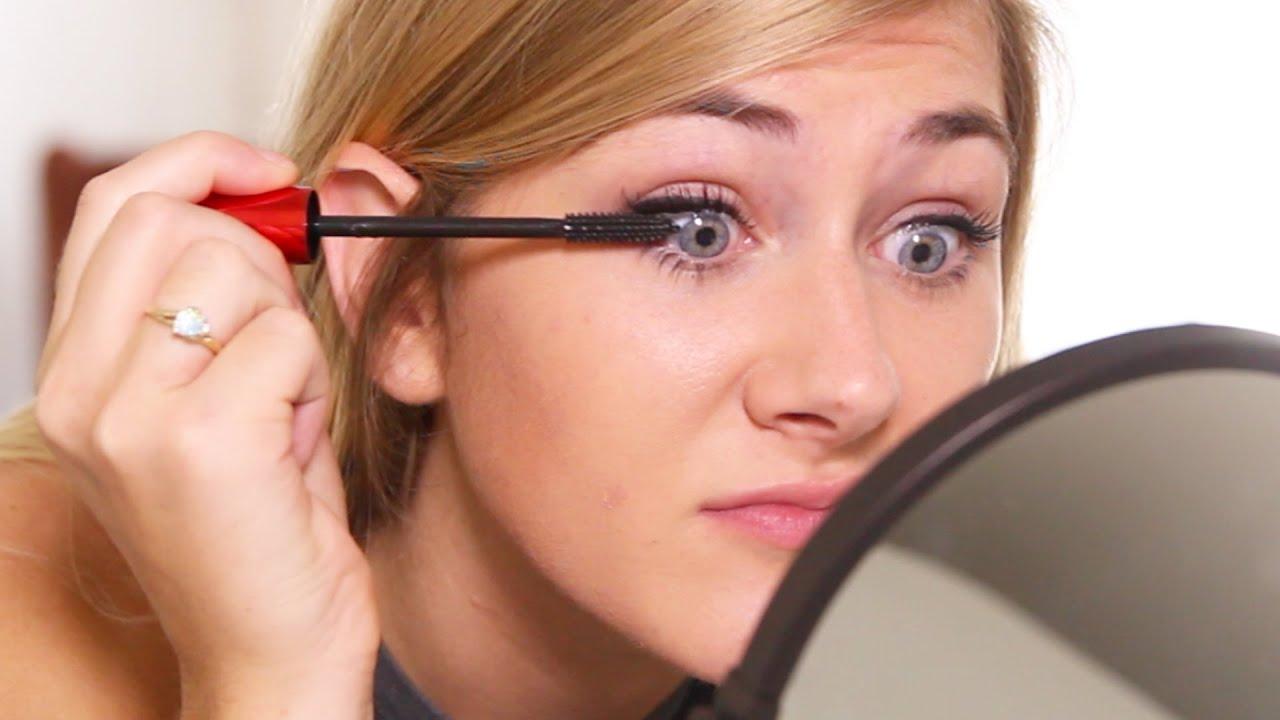 woman struggling with makeup application