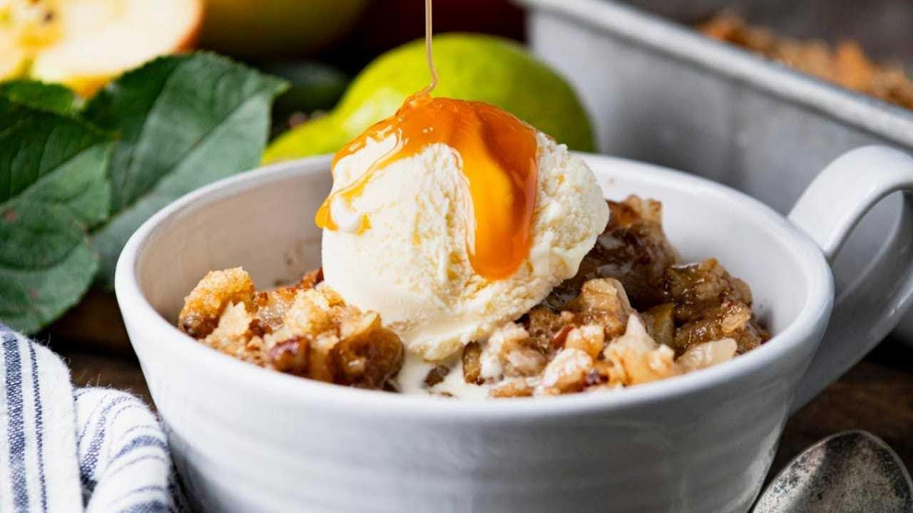 Rustic pear crumble with a scoop of vanilla ice cream