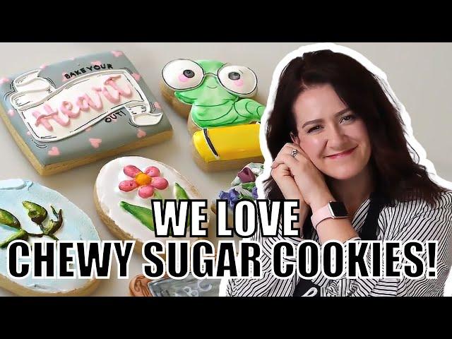 woman happily taking sugar cookies out of the oven