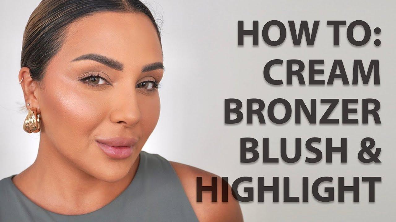woman applying cream bronzer to her face