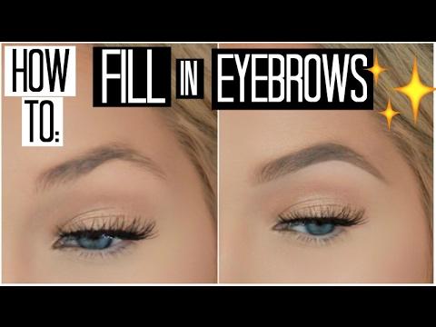 woman filling in her eyebrows with a brow pencil