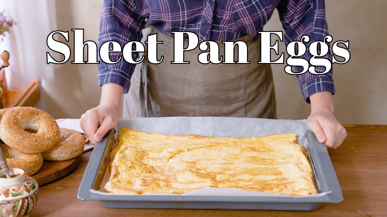 person assembling sheet pan breakfast with fresh ingredients