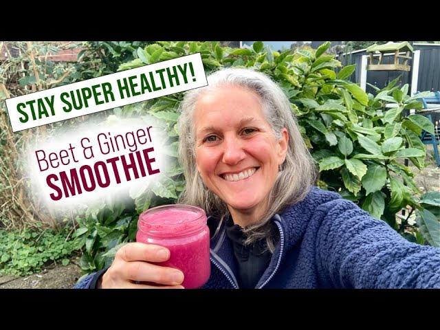 woman drinking a raspberry beet ginger protein smoothie after a workout