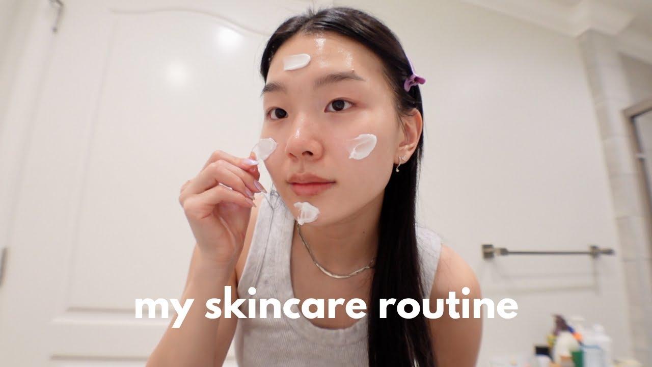 Korean woman with flawless glowing skin demonstrating skincare routine