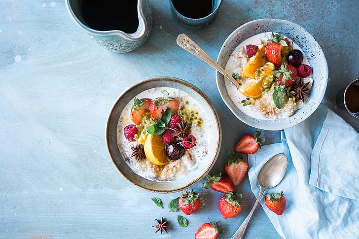 person enjoying a healthy breakfast bowl by a sunny window