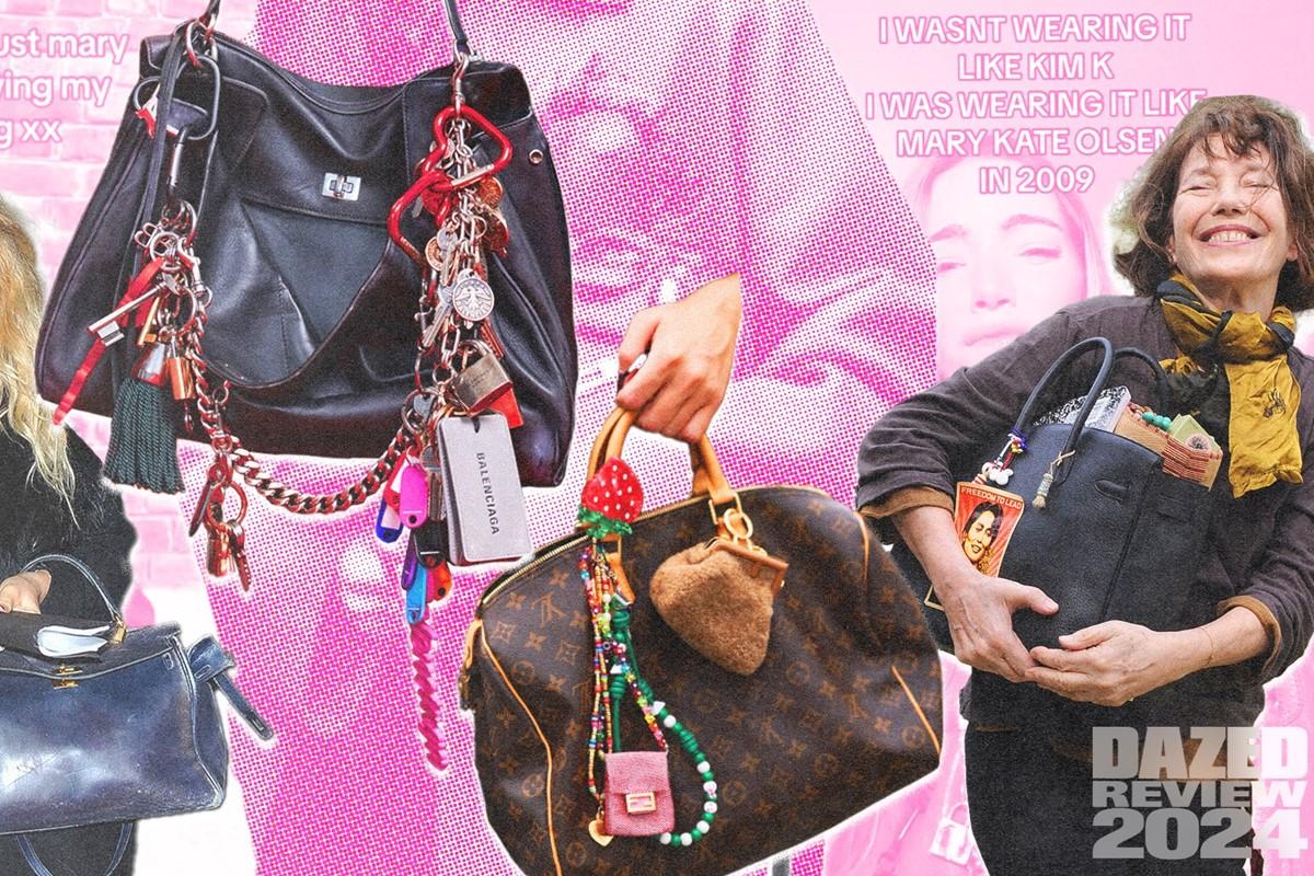 woman looking sadly at a stained designer handbag