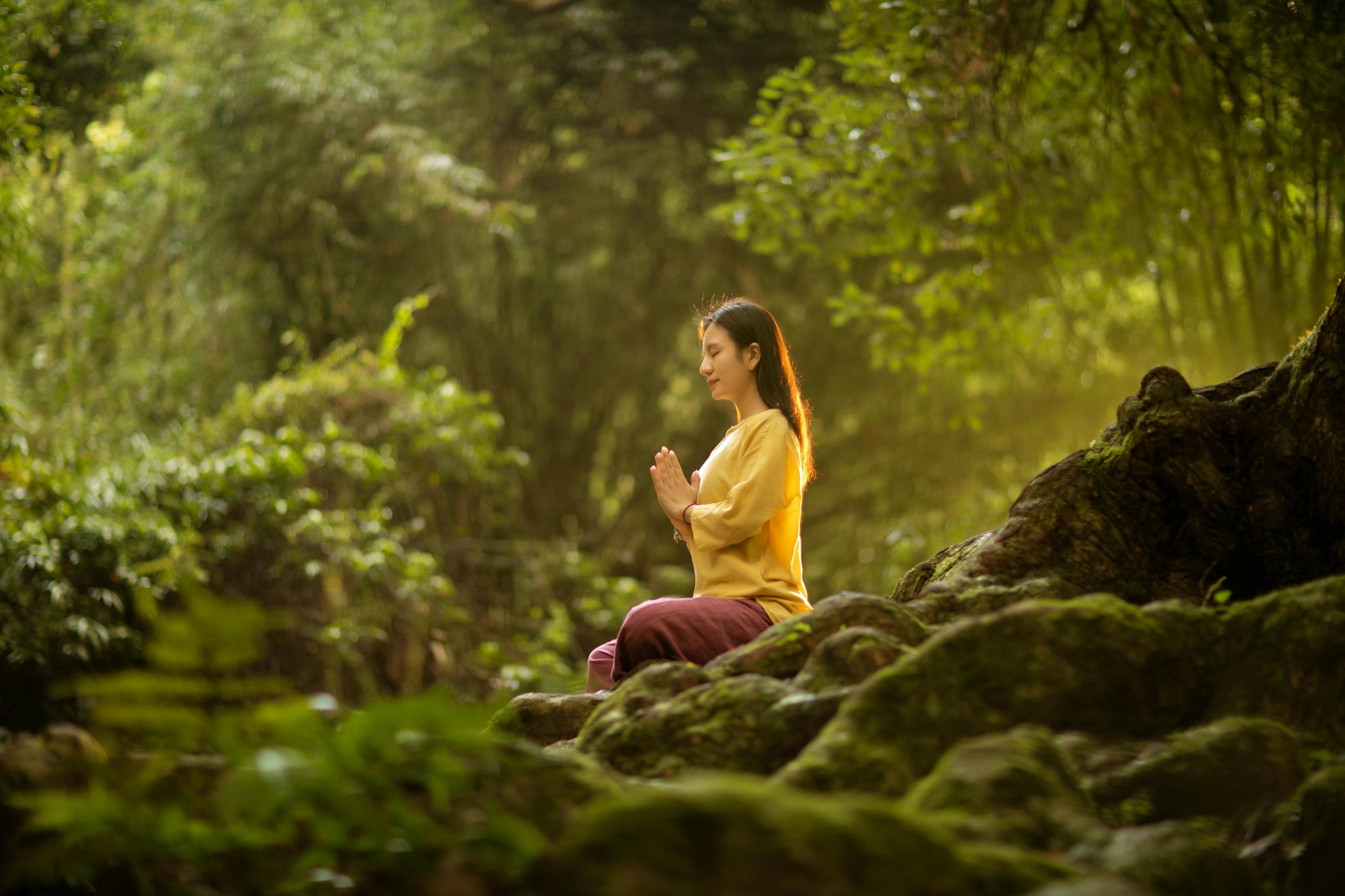 woman meditating in nature