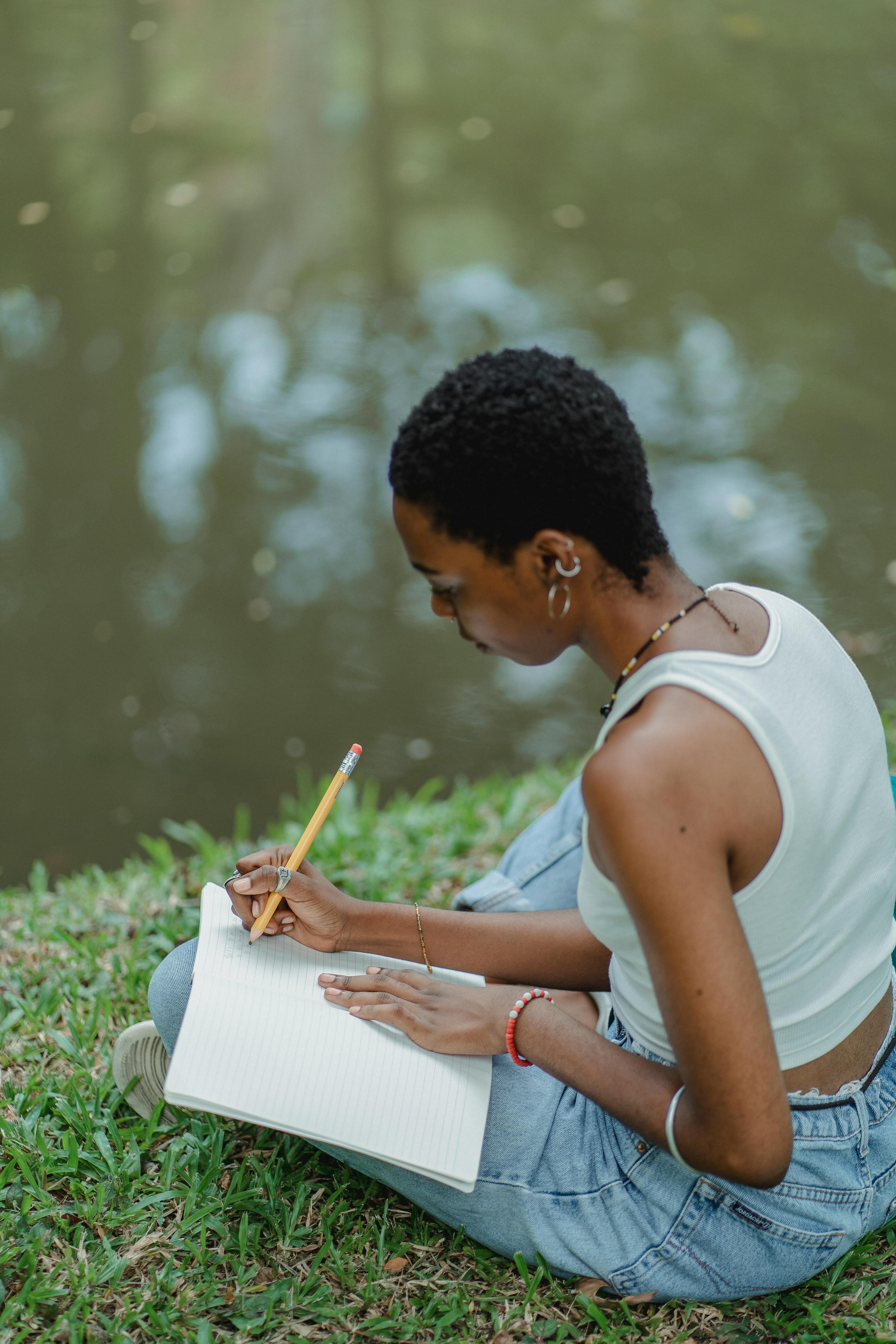 woman writing in journal