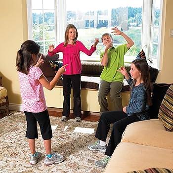 teenagers playing charades indoors