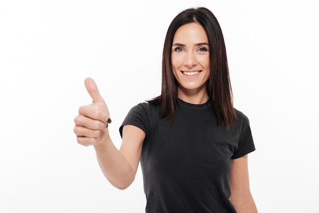 woman smiling and giving a thumbs up