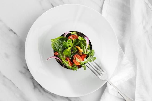 top view of Kamut Berry Kaleidoscope salad on a white plate with a fork