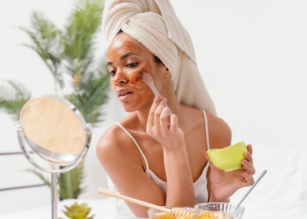 woman applying a homemade face mask