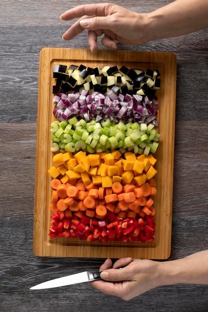 various chopped vegetables arranged on a cutting board