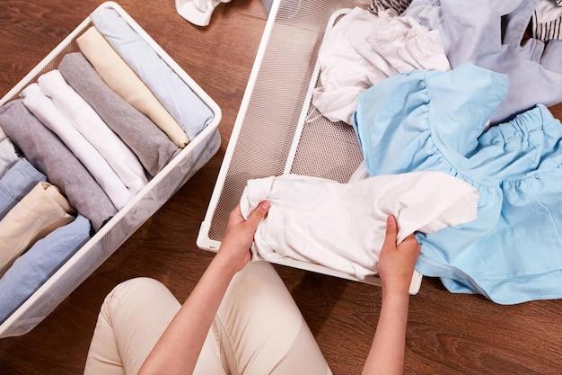 woman sorting through clothes