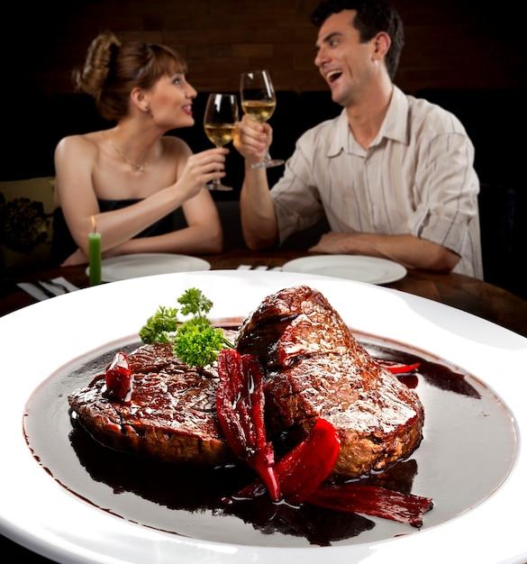couple eating steak at a restaurant in Buenos Aires