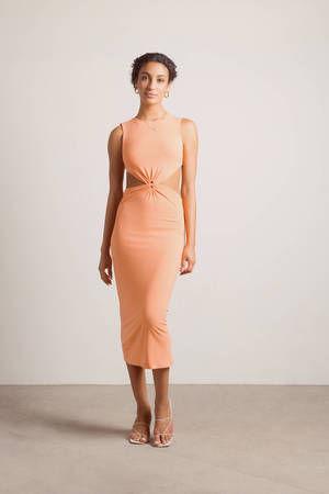 woman in coral midi dress, doing various activities