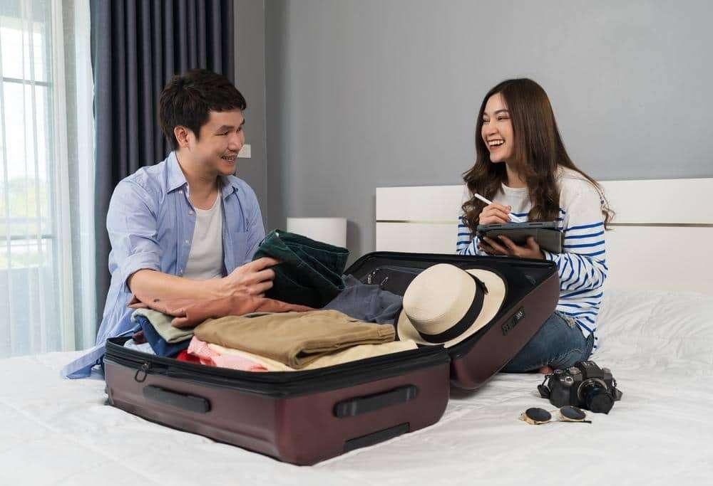 couple packing for vacation