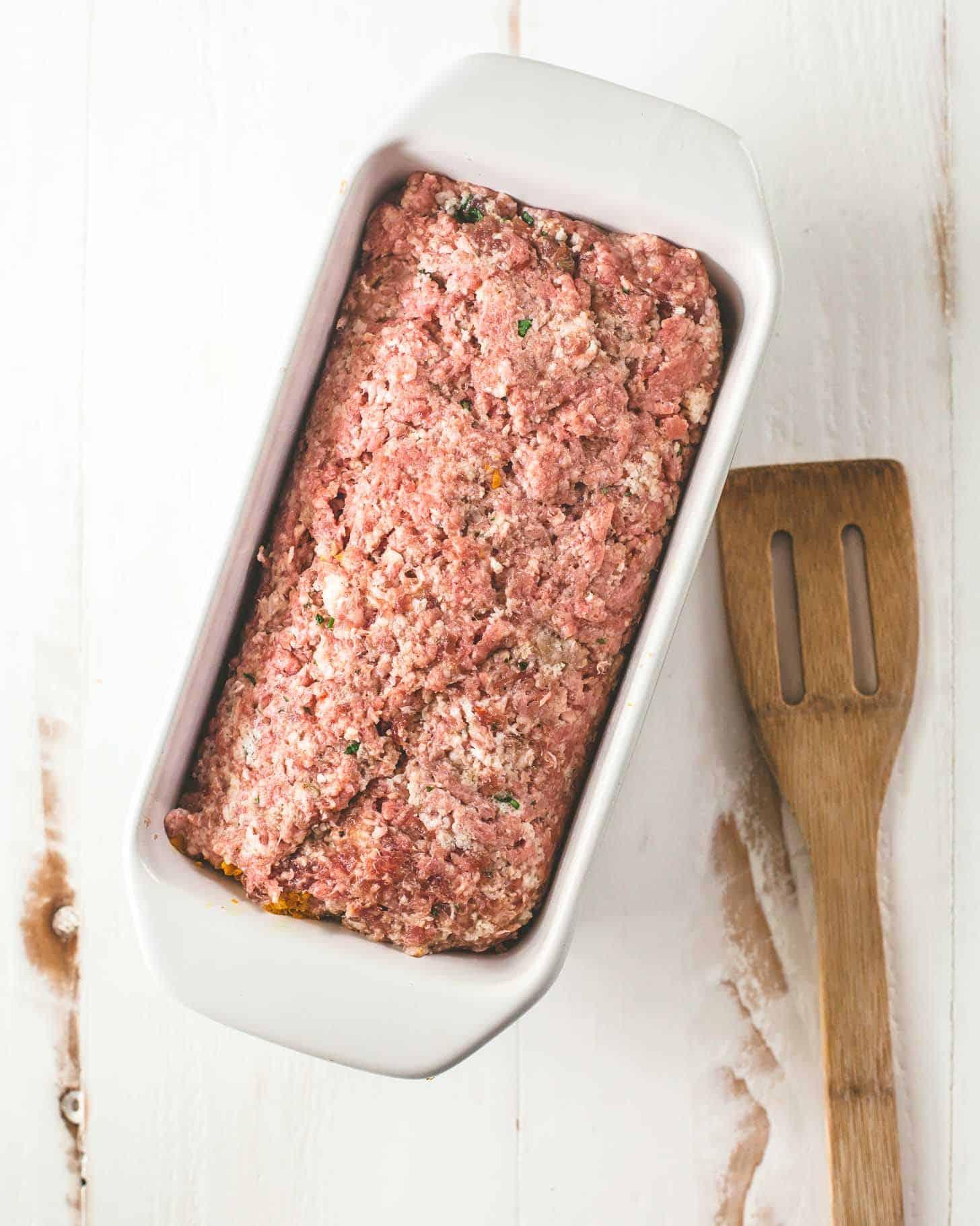 overhead shot of uncooked meatloaf mixture in a loaf pan