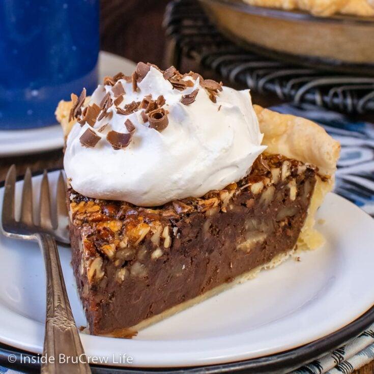 Cross-section of chocolate pecan pie showing the distinct fudgy chocolate layer and whole pecans