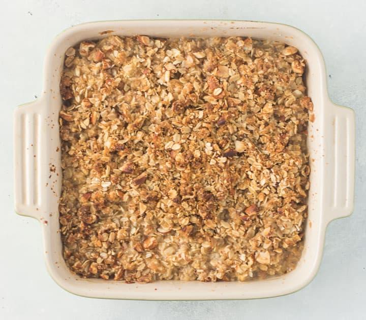 overhead shot of a pear crisp baking in the oven