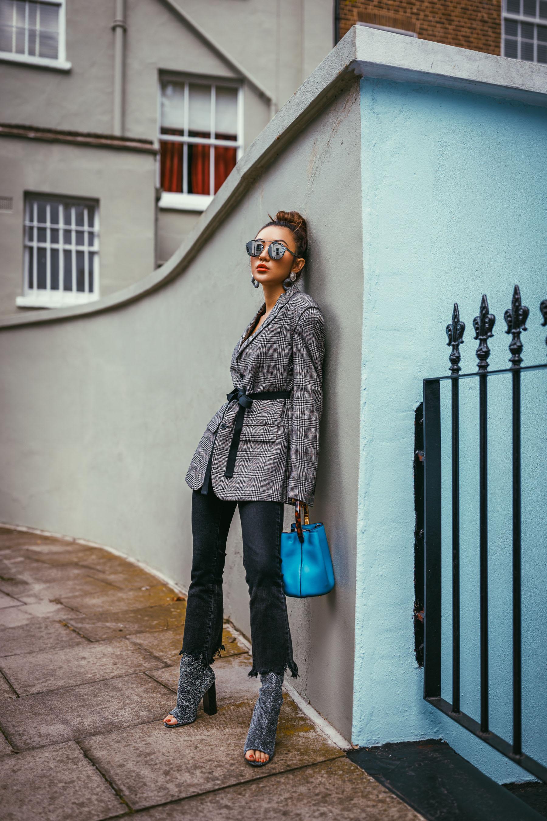 fashion blogger in front of camera showing different outfit styling