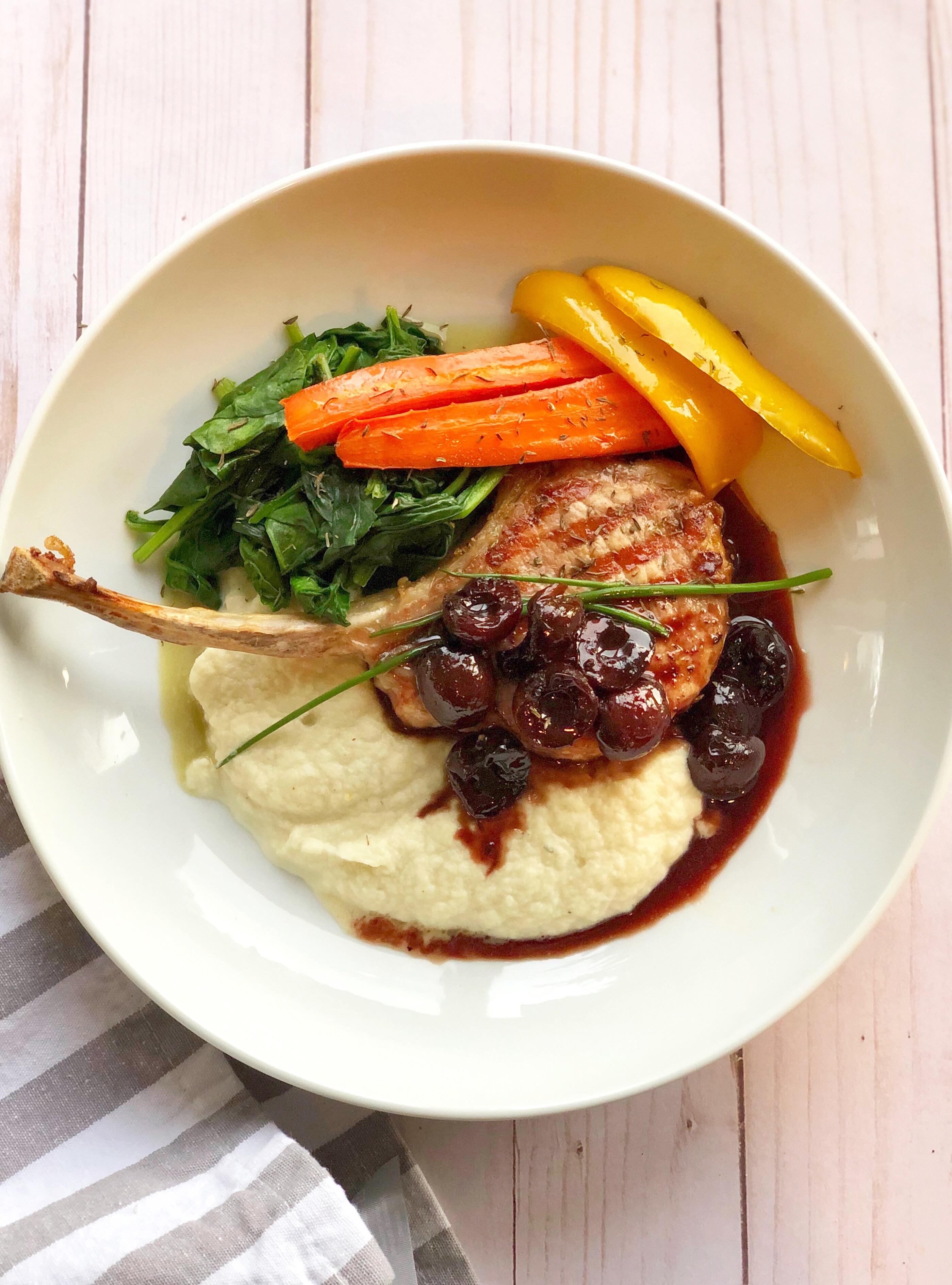 pork chops with cherry reduction sauce plated