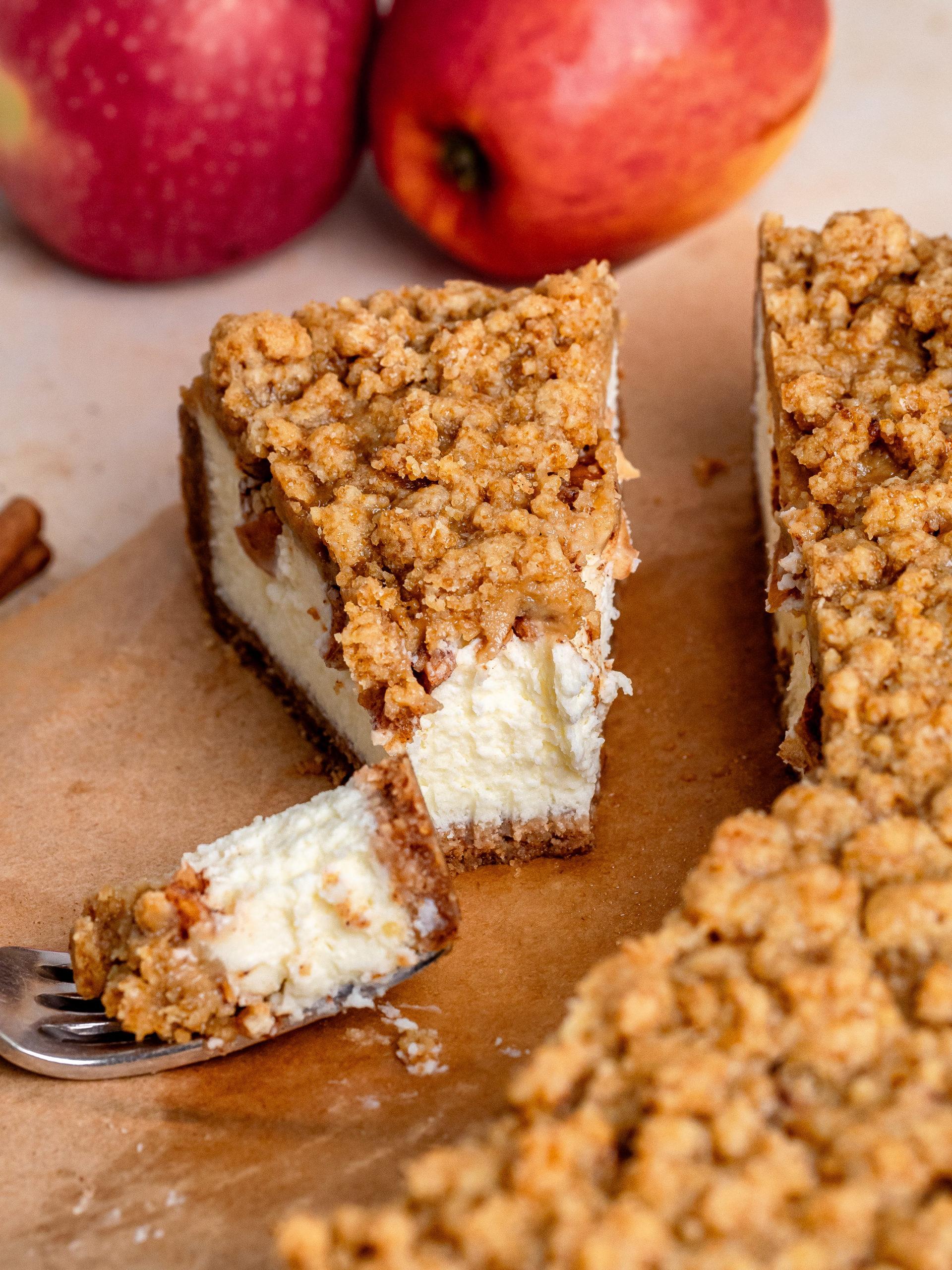 Ingredients for apple crumble cheesecake arranged on a kitchen counter