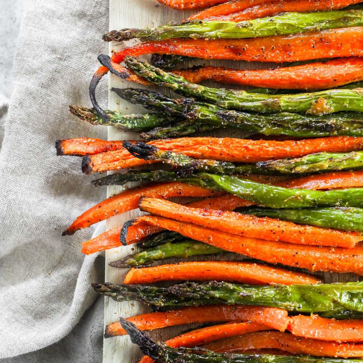 Easter brunch table with glazed carrots and roasted asparagus