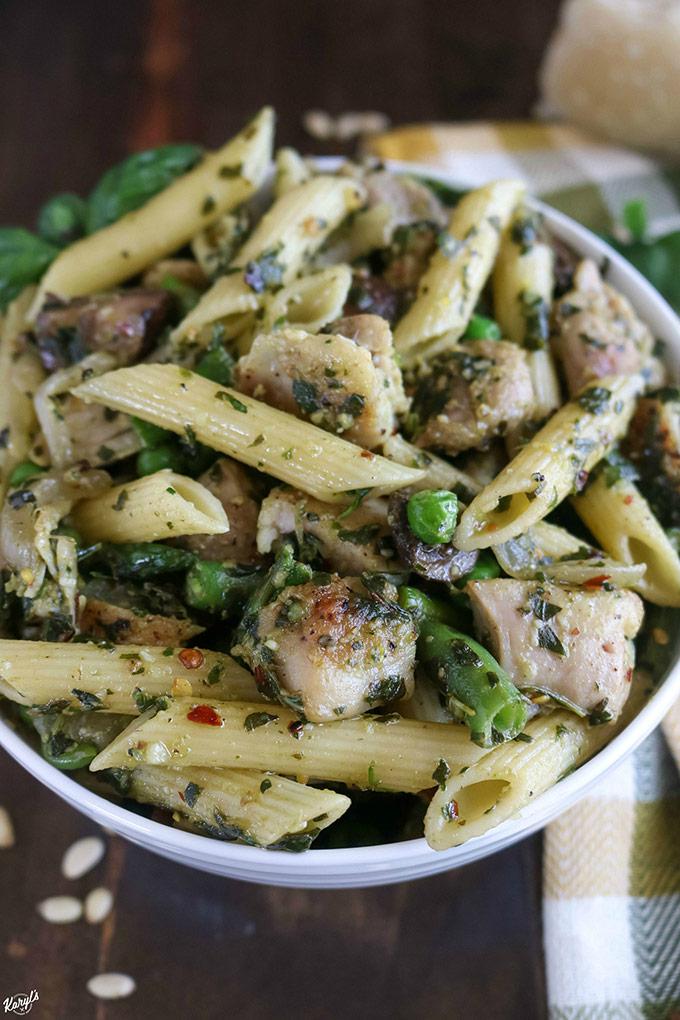 close up shot of pesto chicken pasta in a bento box