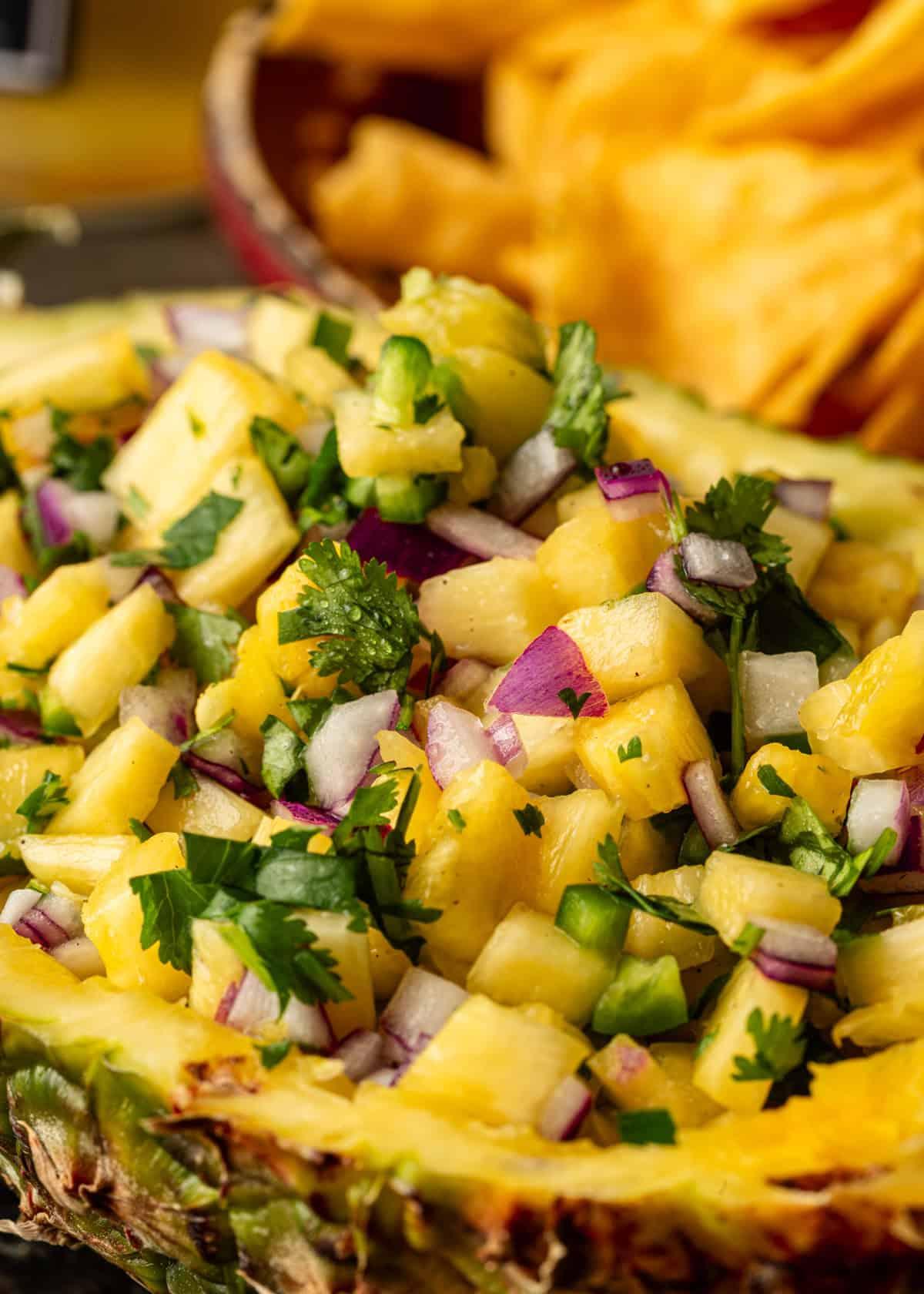 close-up shot of a vibrant pineapple and red onion salsa in a bowl