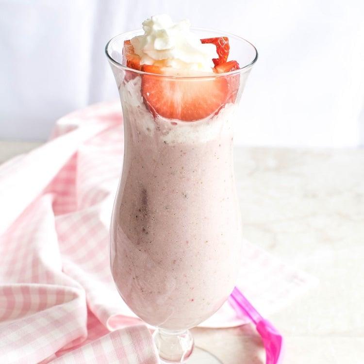 close up of a strawberry shortcake protein shake being blended