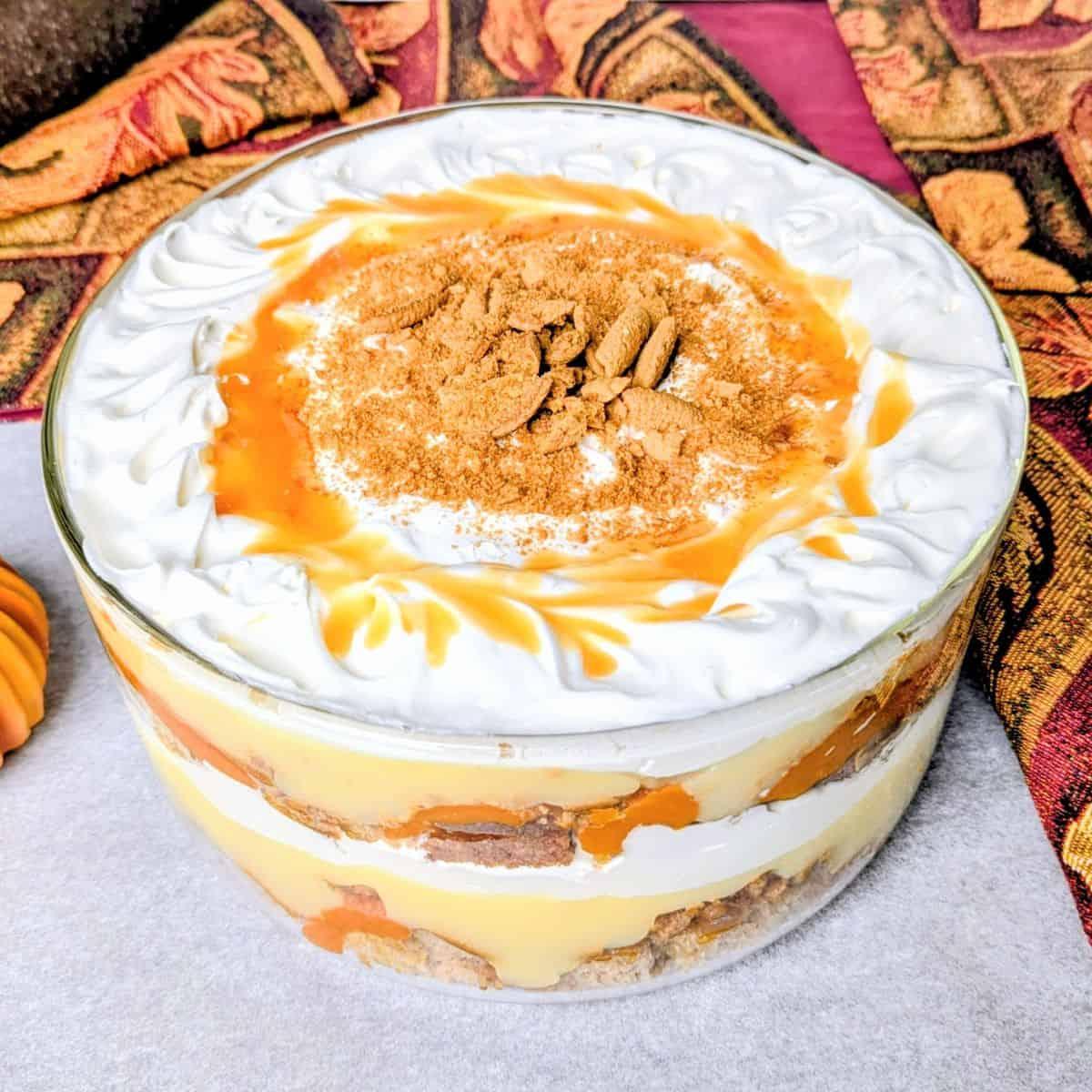 assembling pumpkin trifle dessert in a bowl