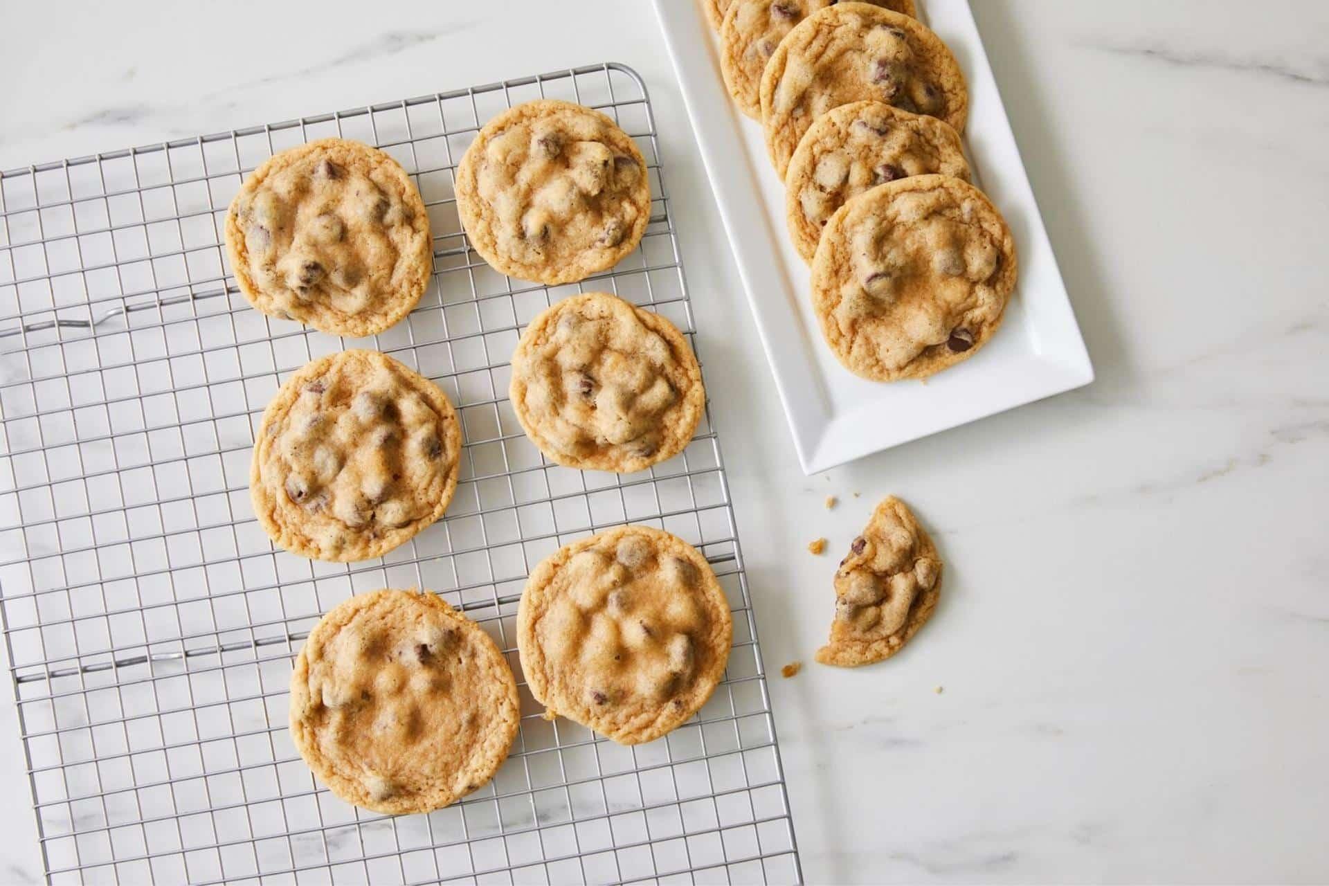 Perfectly baked sugar cookies cooling on a wire rack