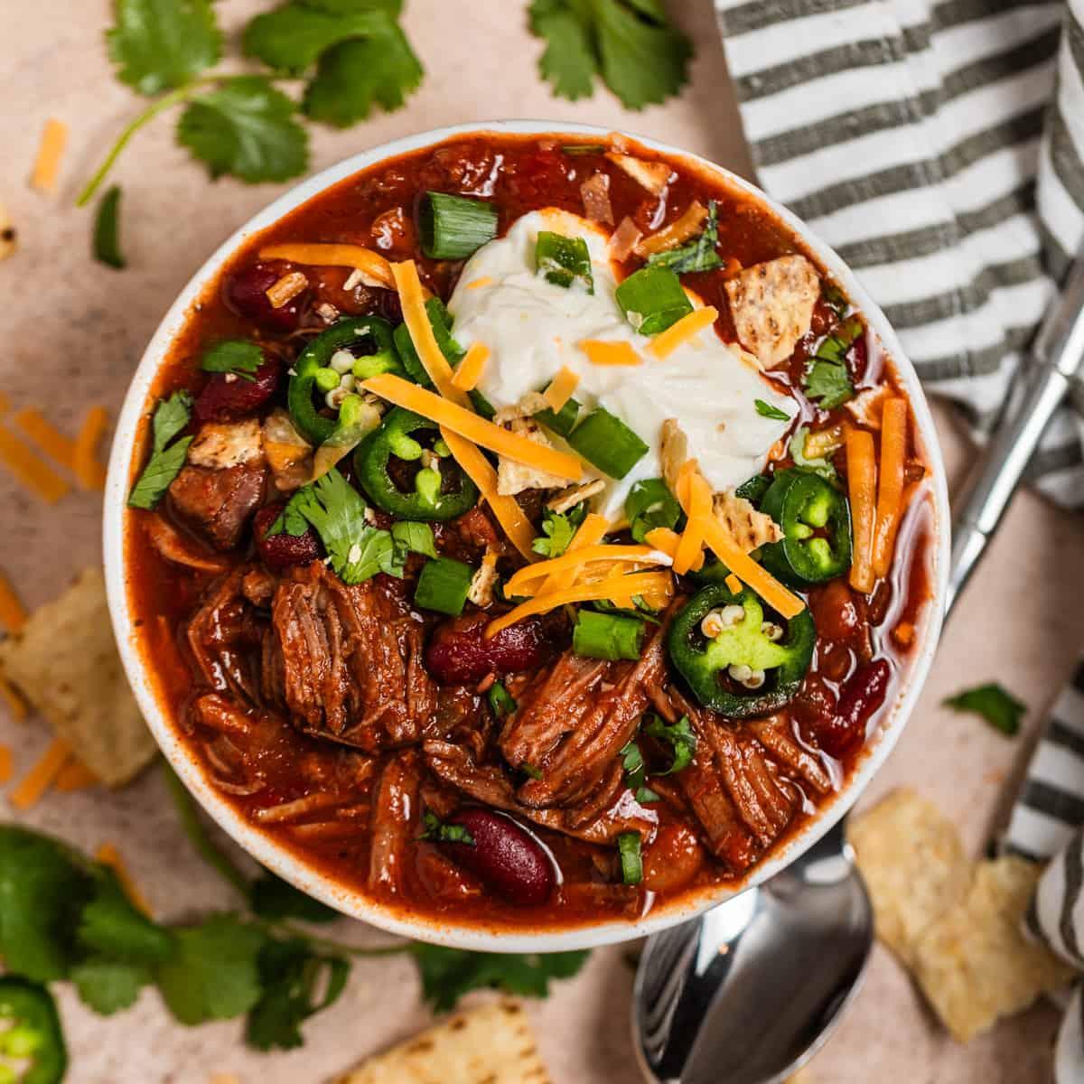 Mouth-watering slow-cooked chili beef roast with vibrant garnishes