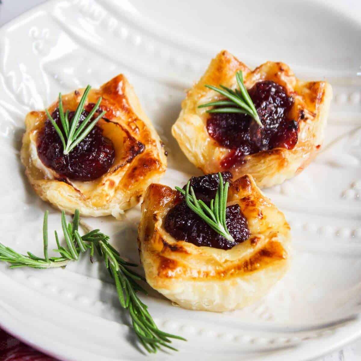 close up of cranberry brie tart with balsamic glaze, showing layers
