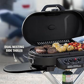 Coleman RoadTrip 285 Portable Stand-Up Propane Grill at a campsite