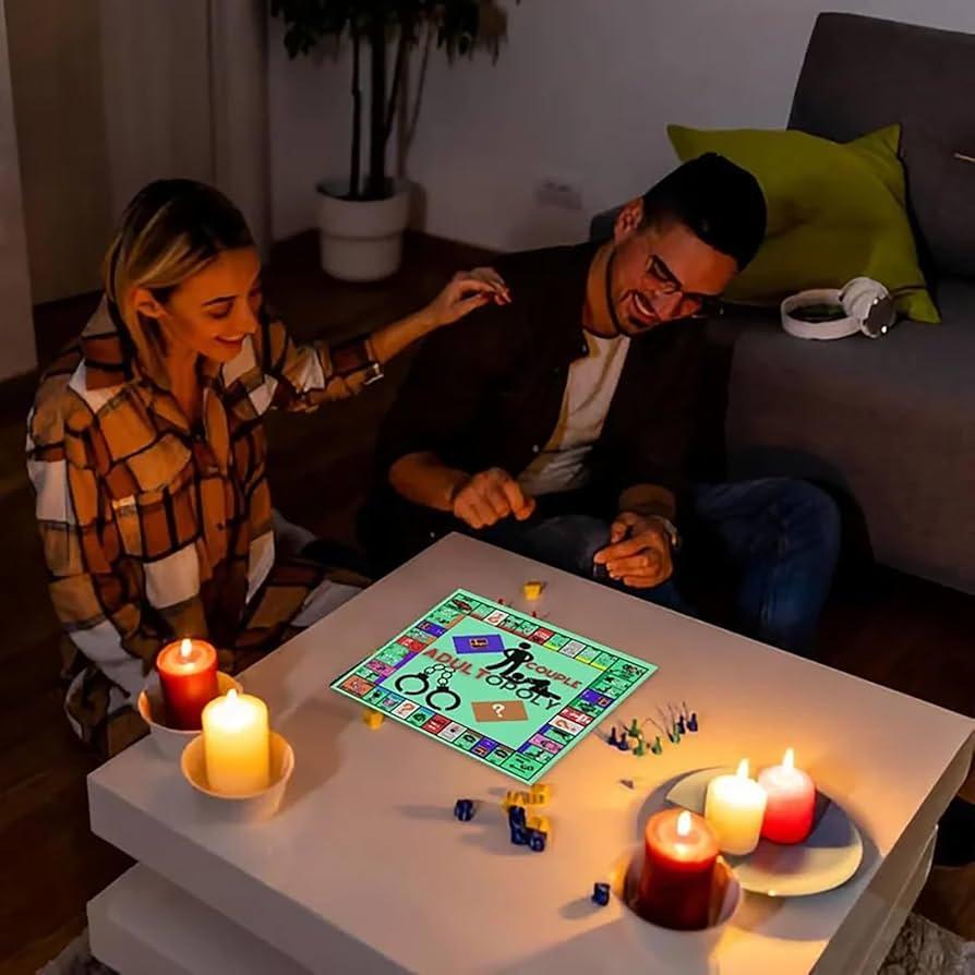 couple playing board games by candlelight
