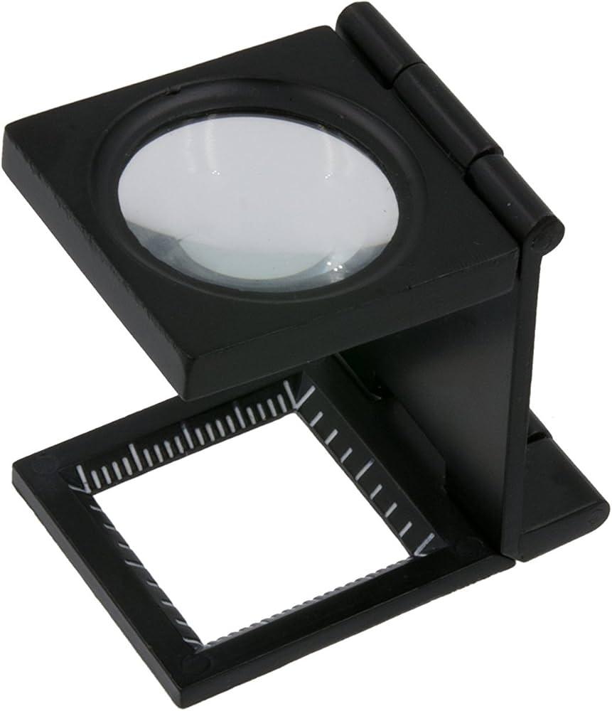 magnifying glass examining sheet threads