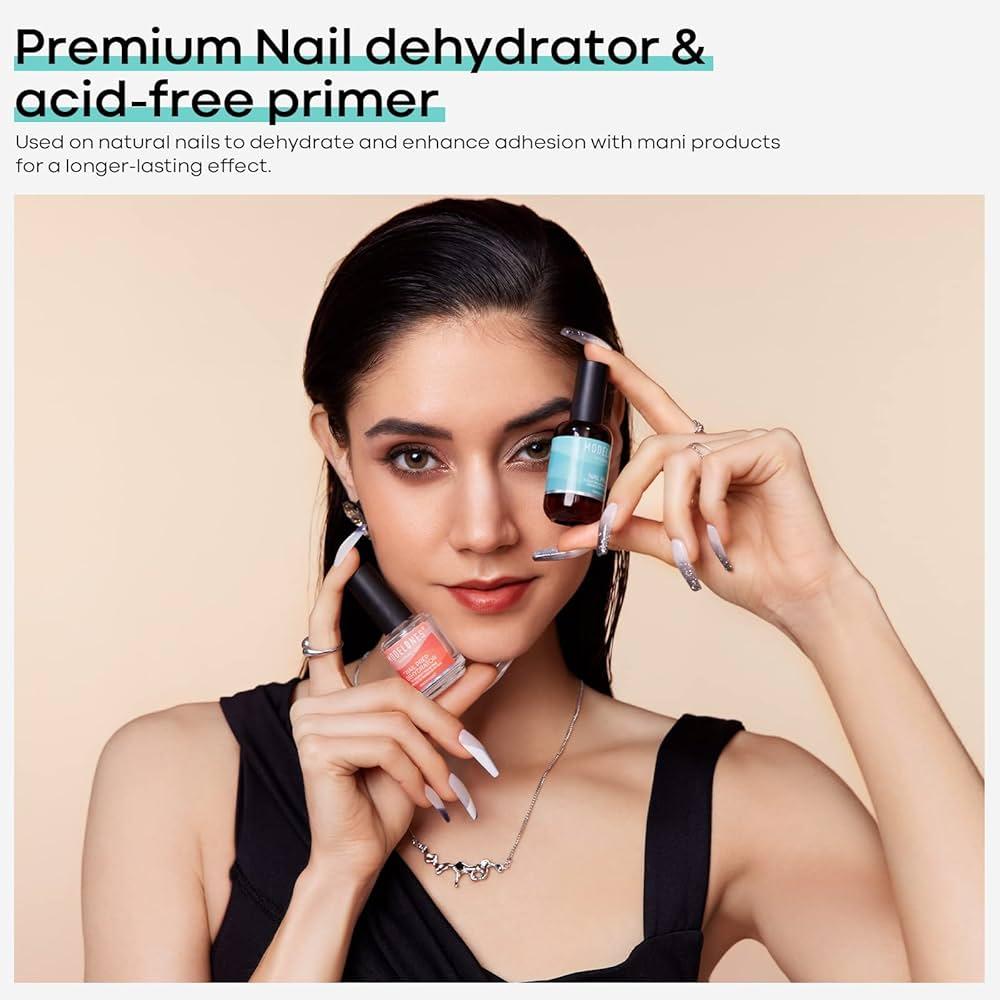 Woman applying acrylic nail primer