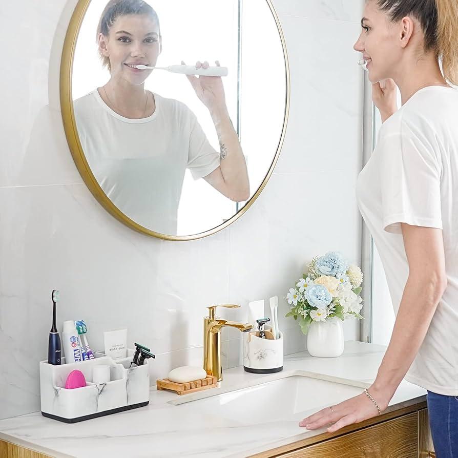 woman cleaning toothbrush holder in a bathroom sink