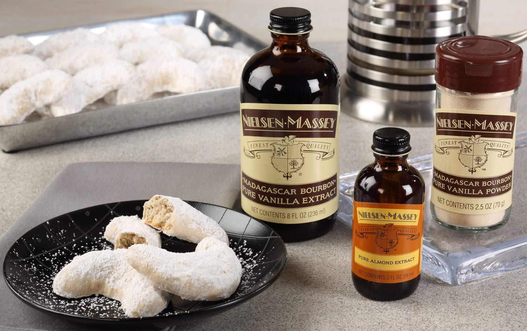 bottles of vanilla extract and almond extract side by side