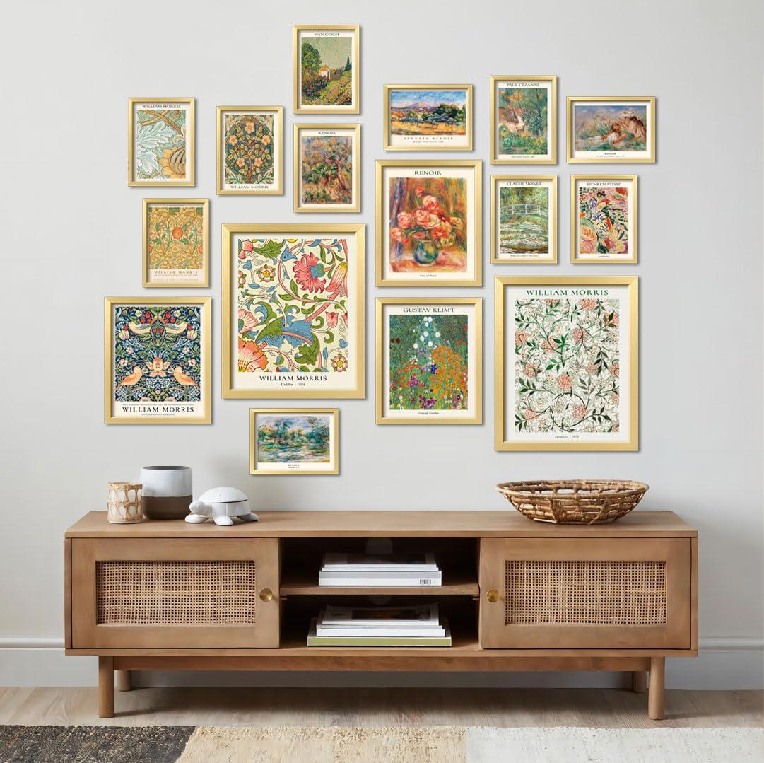 A dorm room gallery wall with various posters and frames