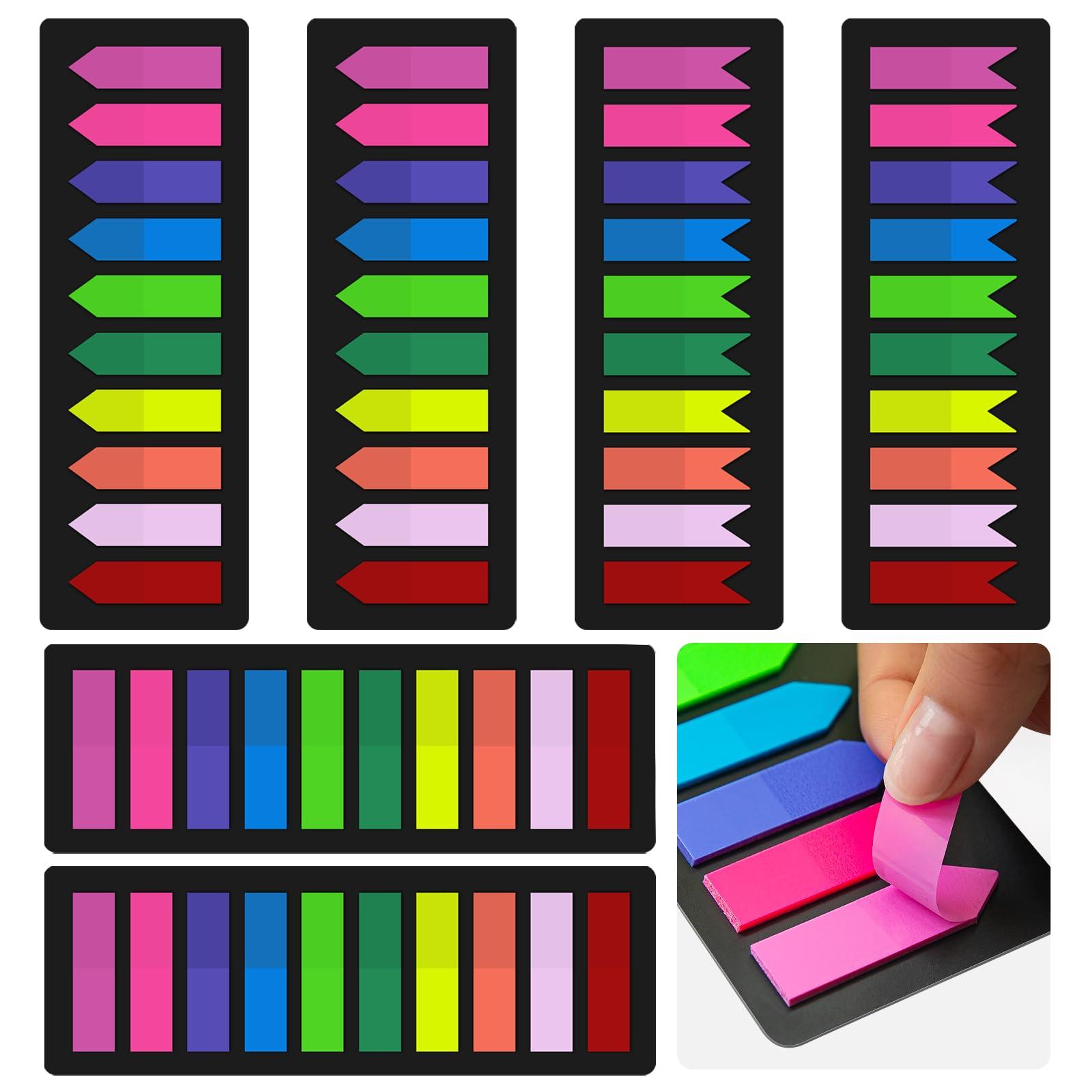 colorful sticky notes and flags used to mark pages in textbooks