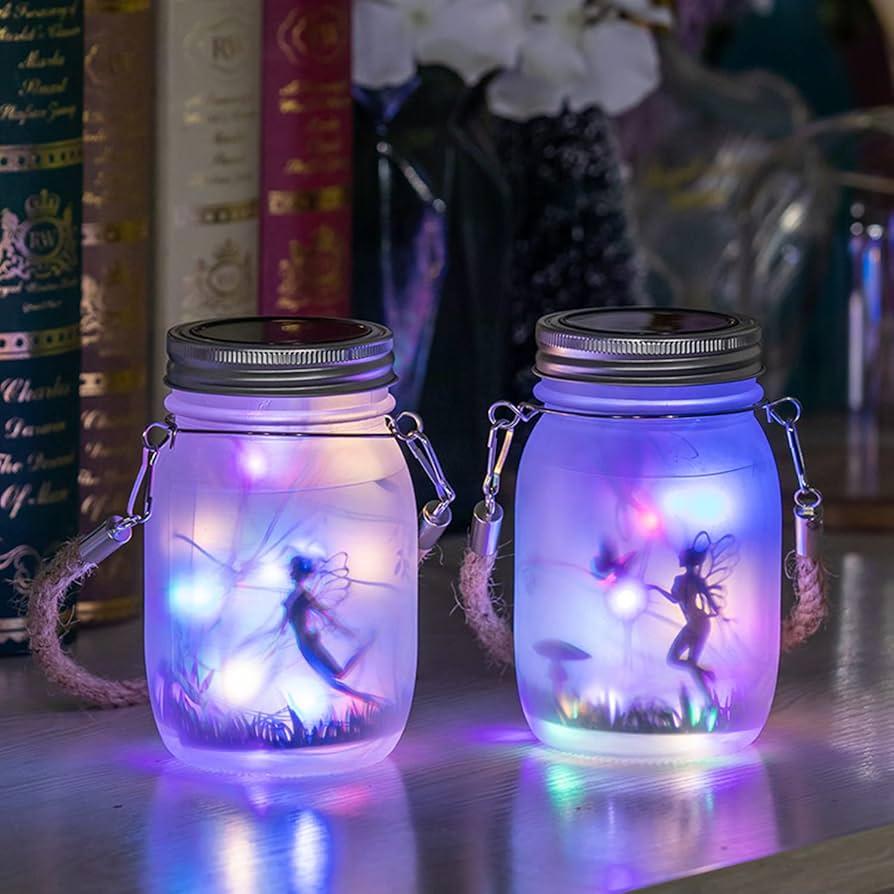 Mason jar lanterns with fairy lights outdoors