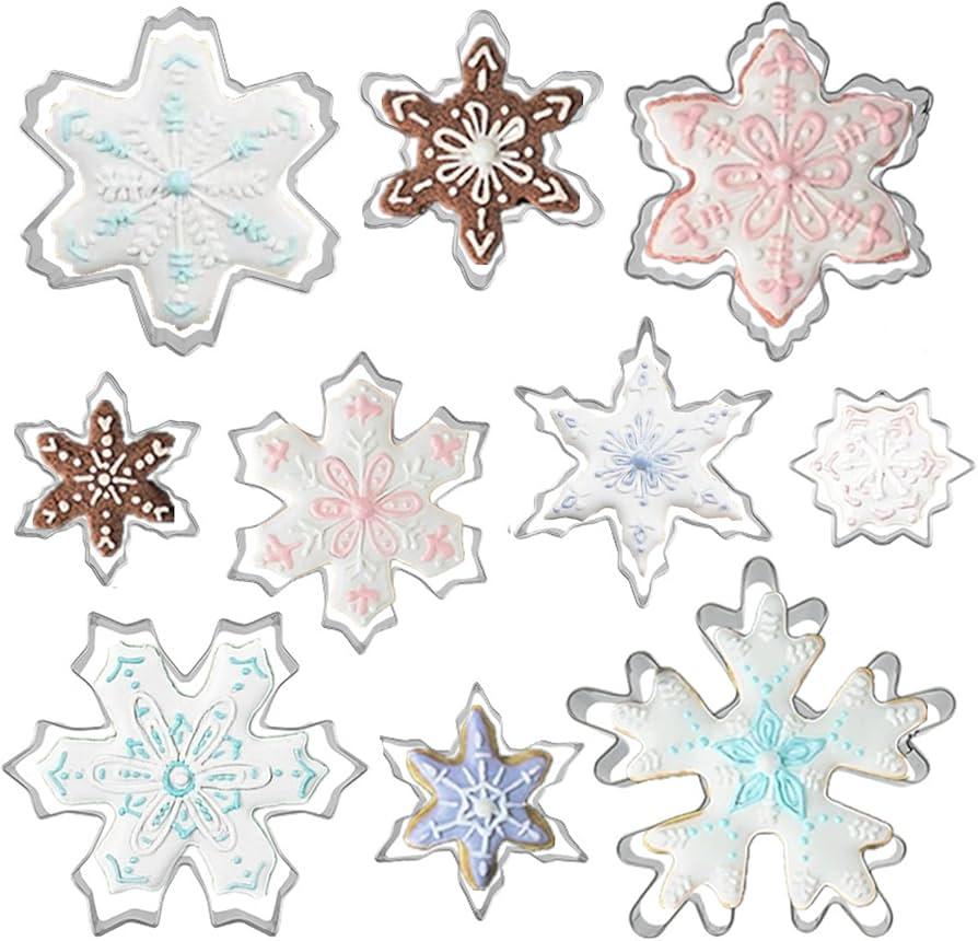 various snowflake cookie cutters on a lightly floured surface
