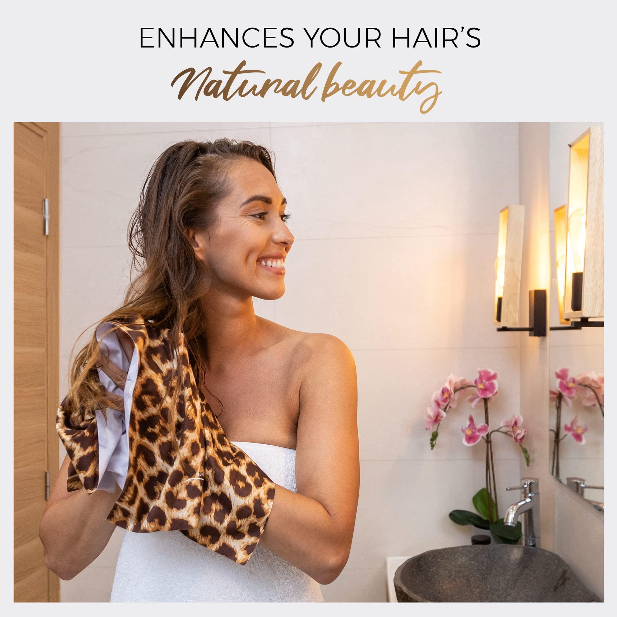 woman gently scrunching her curly hair with a microfiber towel