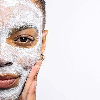 Close-up of a clay mask being applied to oily skin