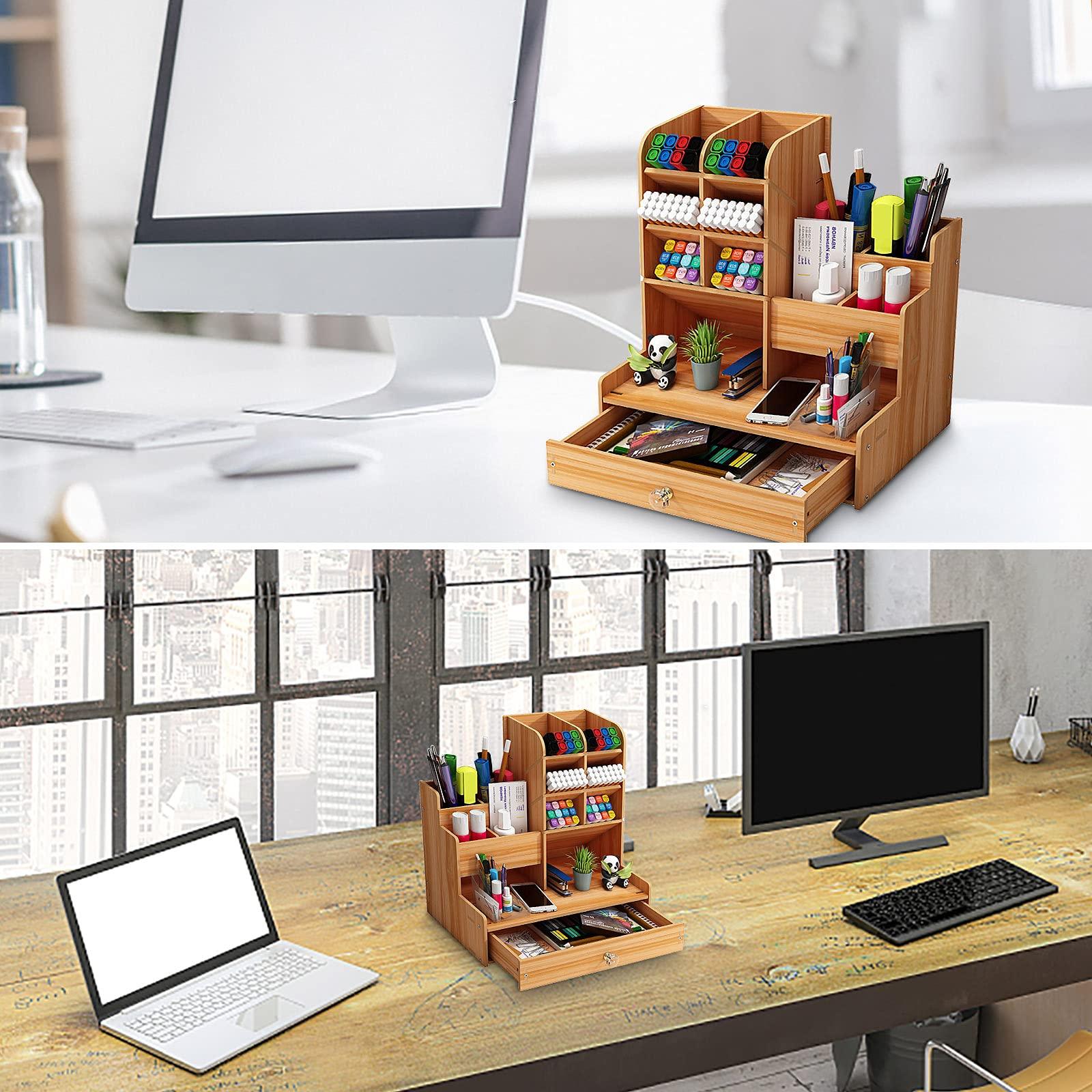 organized desk with a laptop, notebooks, and pens