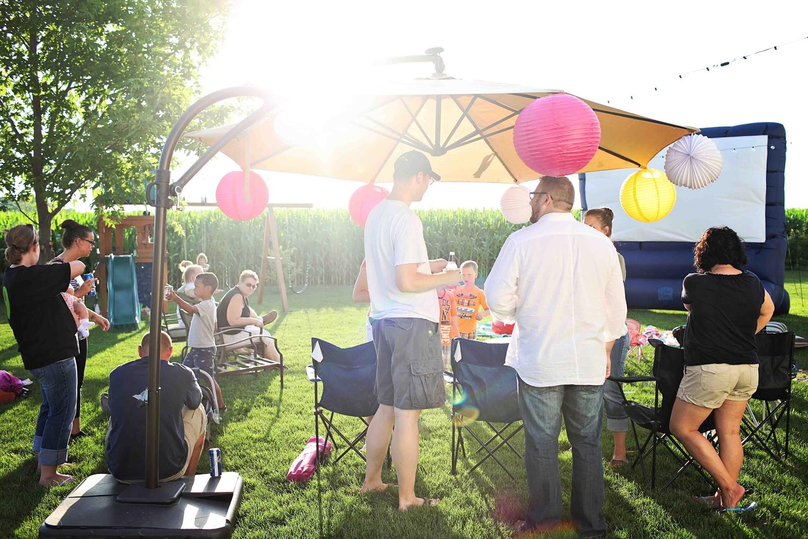 people cleaning up after a party in a park