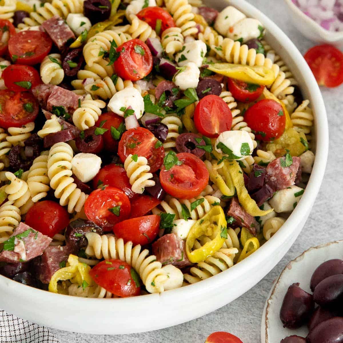 gluten-free pasta salad being served at a summer gathering